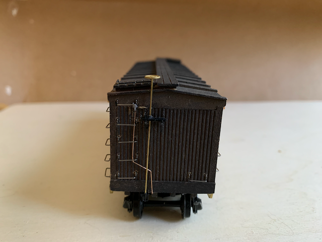 Assembled, unpainted HO scale box car, B end view.