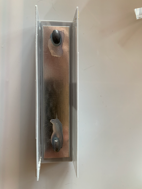 HO scale box car floor with both sides attached, but ends and roof missing.