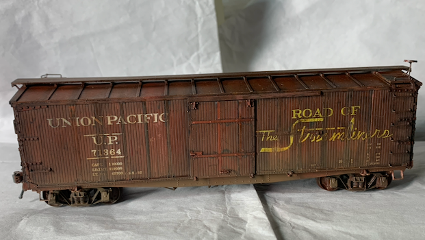 Completed, heavily weathered UP box car in HO scale.