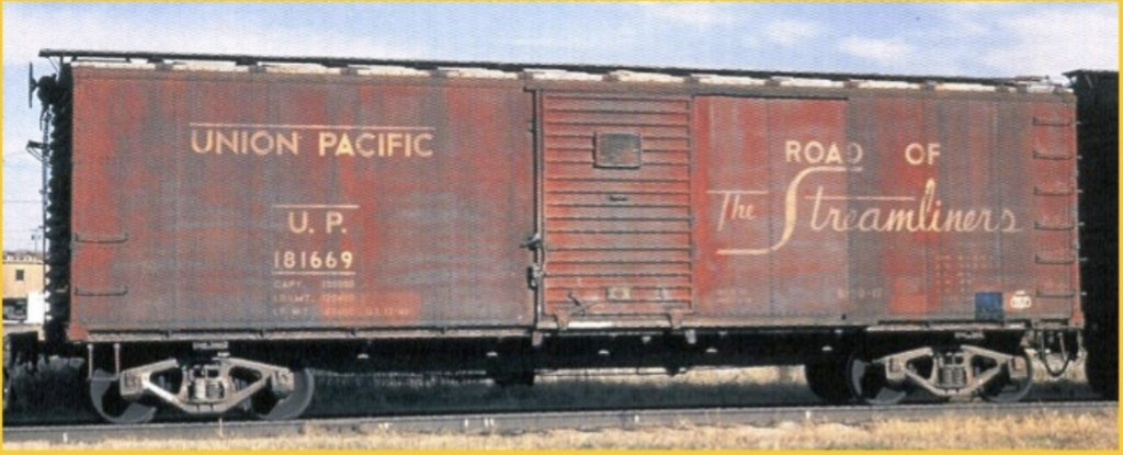 Color prototype photo of a Union Pacific steel box car that is heavily weathered. From Harley Trains.