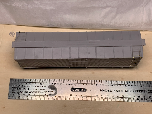 Top-down view of an unpainted HO scale resin box car. HO scale ruler for size reference.