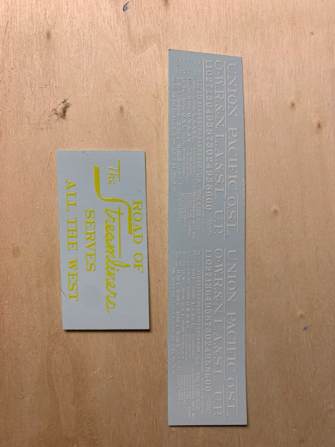 Decals for a B-50 box car in HO scale in two sheets. One has white lettering and the other has the large UP logos "Road of the Streamliners" and "Serves All the West".