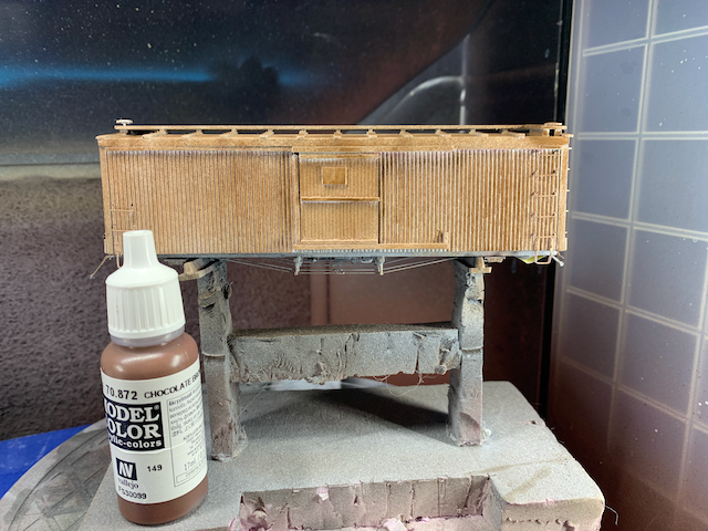 HO scale wooden box car with a layer of Vallejo Chocolate Brown paint.
