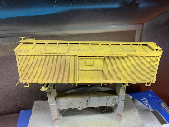 HO scale wooden box car with a layer of depot buff, which looks quite yellow.