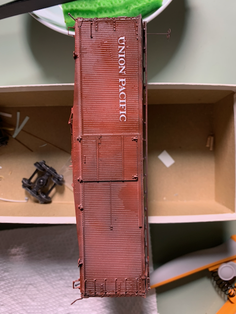 HO scale painted box car being decaled for Union Pacific.