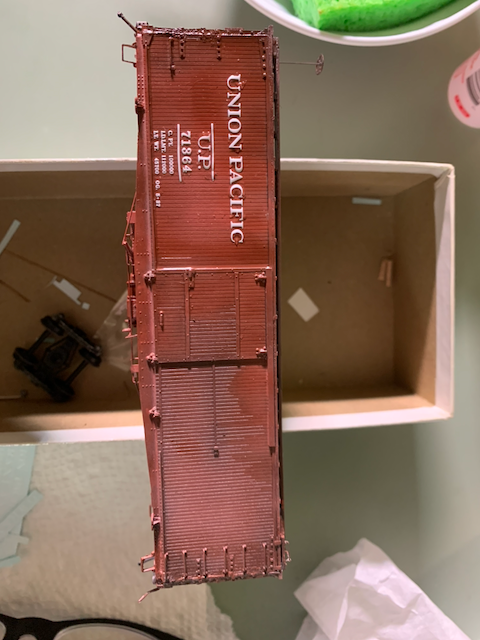 HO scale painted box car being decaled for Union Pacific.