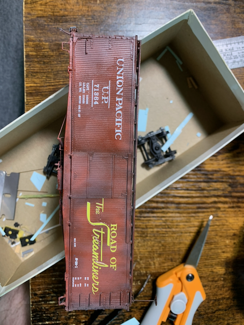 HO scale painted box car being decaled for Union Pacific.