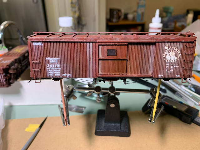 HO scale CNJ box car with a heavily weathered side.