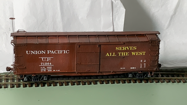 HO scale box car painted and decaled, awaiting weathering.