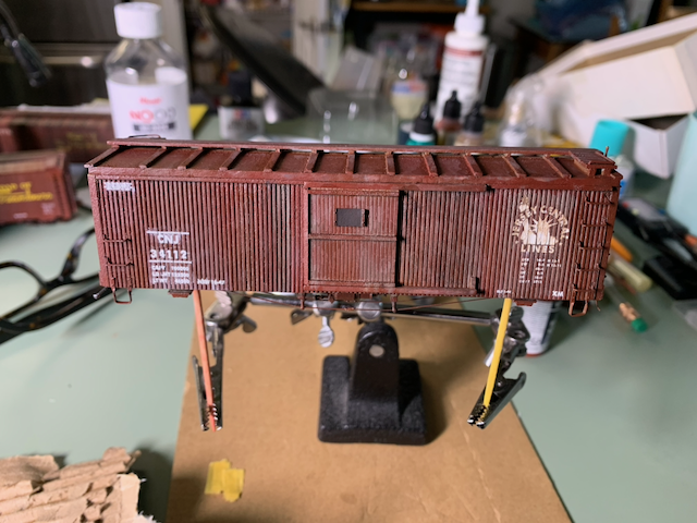 HO scale CNJ box car with a heavily weathered side.