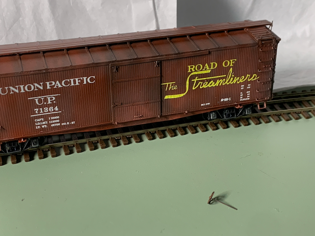 HO scale box car painted and decaled, awaiting weathering. Brake staff replacement.