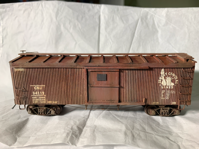Completed HO scale CNJ box car, side view.