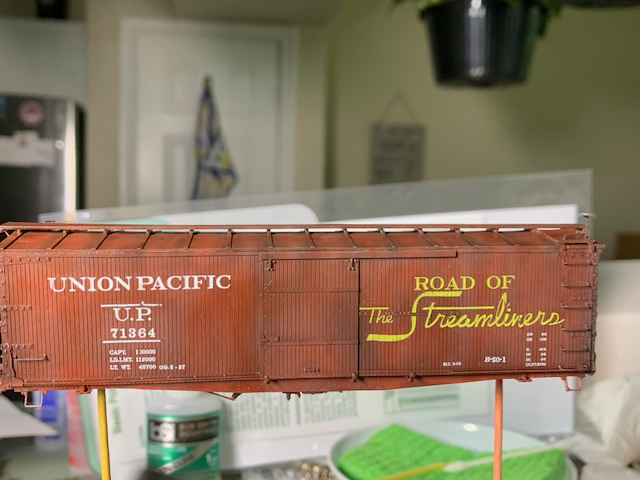 HO scale UP box car being panel lined.