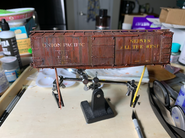 Heavily weathered HO scale UP box car, post-oil weathering.