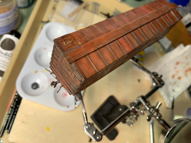 Blended oils creating a variegated color on the roof of an HO scale UP box car.