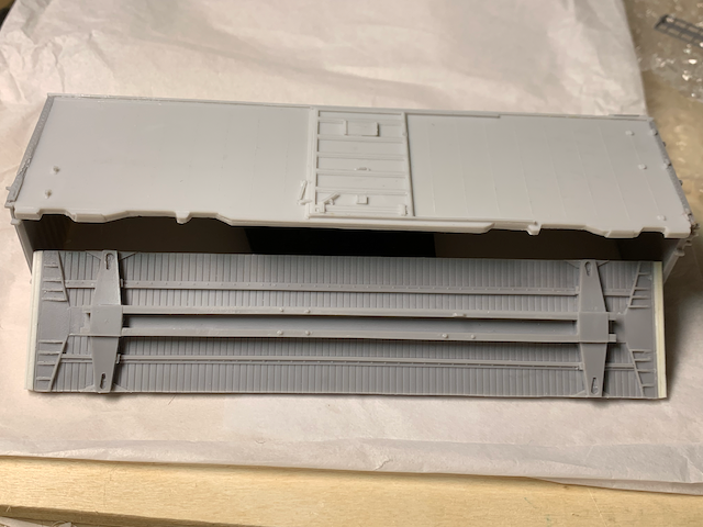 HO scale box car with the floor now the correct length being fitted into the assembly.