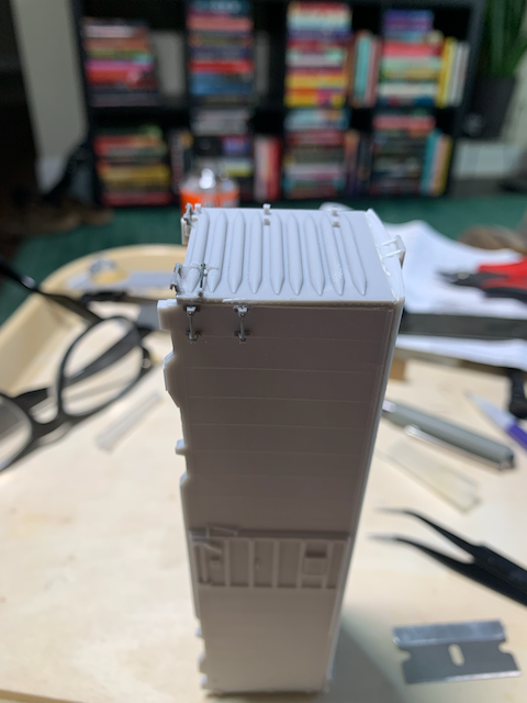 HO scale box car end after gap filling with the mask removed. New grabiron detail is visible.