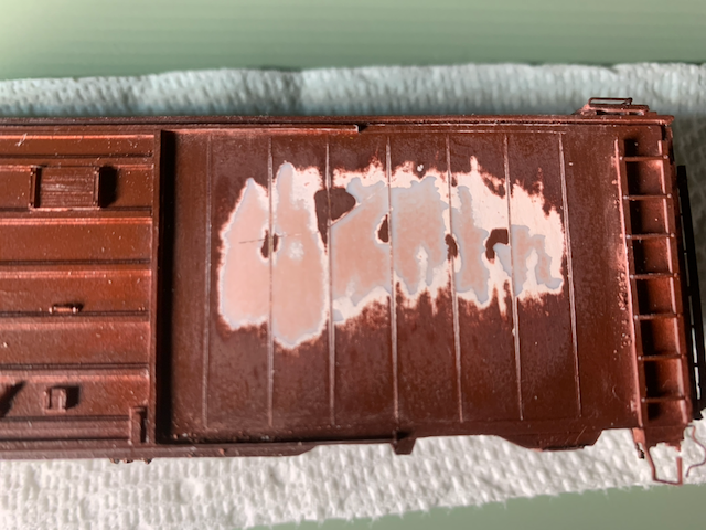 HO scale box car after the side paint was destroyed removing the broken decal.