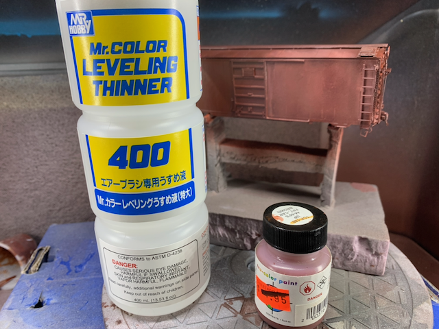 HO scale box car being spot repainted with Tru-Color UP freight car red.