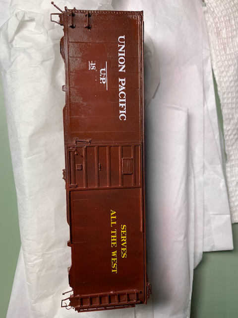 HO scale UP box car being decaled.