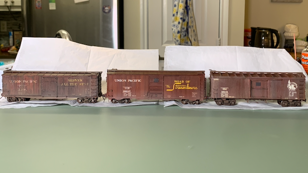 HO scale UP box car coupled to its partner UP box car and a CNJ box car.