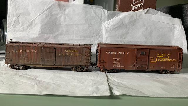 Two HO scale UP box cars.